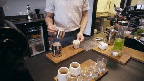 Barista Works in Artisan Cafe Shop