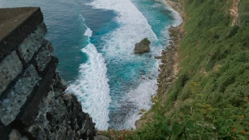 Aerial View of a Couple Diving Snorkeling Thru the Corals on a Paradise Beach, During a Romantic