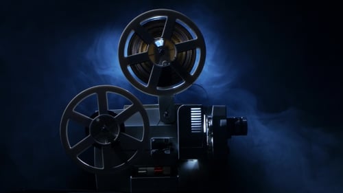 Vintage Film Projector with Reels in Dark Fog