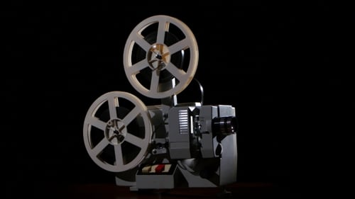 Old Projector Showing Film. Studio Black Background
