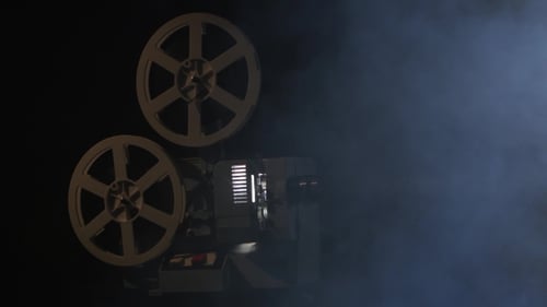 Working Projector in the Smoke. Black Background Studio