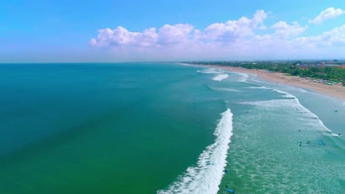 Surfers On The Beautiful And Powerful Waves Of The Ocean