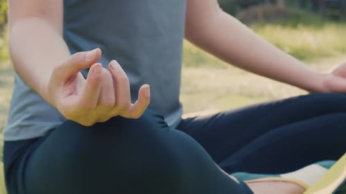 Close up of hands Asian female sitting in meditation pose position yoga.