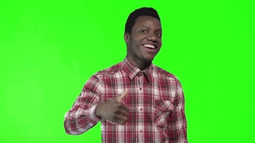 Smiling Man Giving Thumbs Up on Green Screen