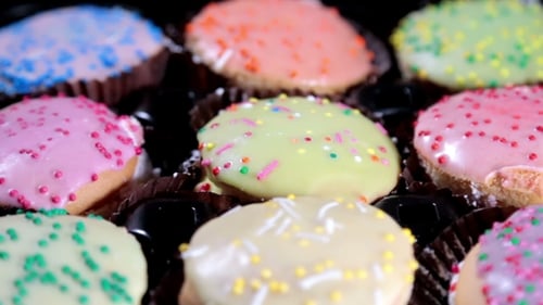 Delicious Assorted Frosted Cookies Spinning in Studio
