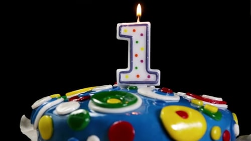 Festive First Birthday Cake with Lit Candle
