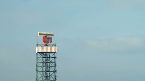 Rotating Airport Surveillance Radar Against Blue Sky