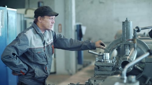 Industrial Worker Operating Milling Machine
