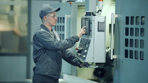 Industrial Engineer Worker Operating Control Panel System at Manufacture Plant