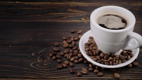 Dark Coffee and Beans on Rustic Wood Table