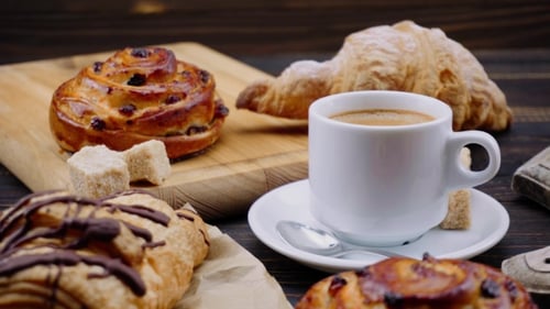 Close Up of Coffee and Pastries on Table