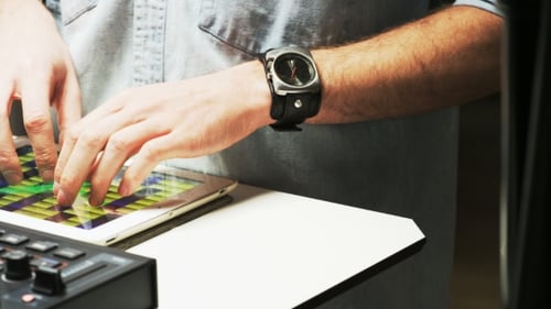 Disc Jockey's Hands While He Changes Settings of the Sound Control System