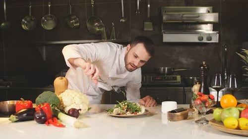 Chef Prepares Gourmet Salad in Kitchen
