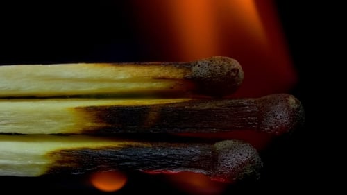 Burning Matches Macro Close Up on Black Background