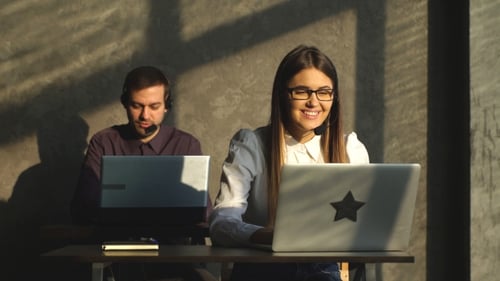 Side View of Young Call Center Agents at Work