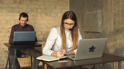 Young Office Workers Using Computers in an Office