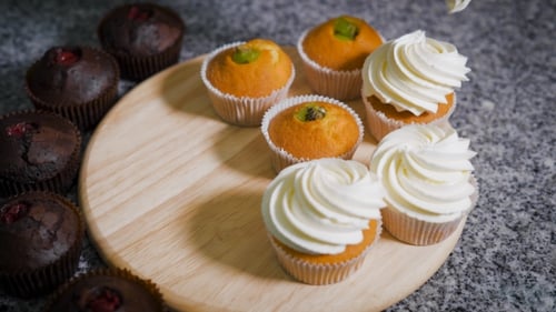Candy Store. The Confectioner Cooks Cupcakes