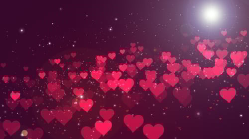 Glowing Red Hearts Floating on Sparkly Romantic Background