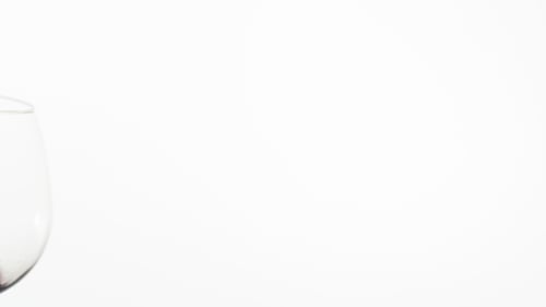 Red Wine Being Swirled in a Clear Glass