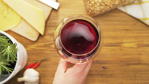 Swirling Red Wine Overhead at Table