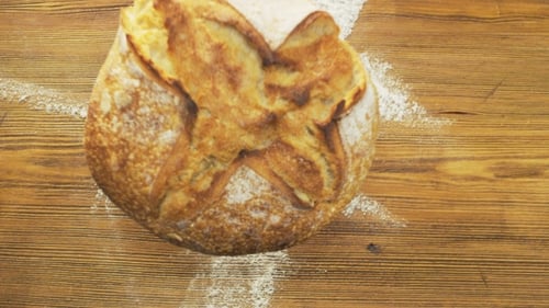 Round Loaf of Bread Falling Down