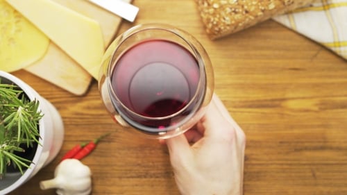 Overhead Shot of Wine Glass with Cheese and Bread