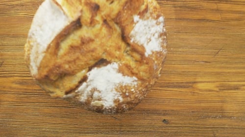 Round Loaf of Bread Falling Down