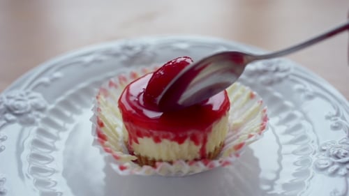 Eating Strawberry Cheesecake with a Silver Spoon