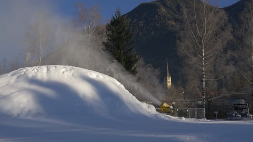 Snow Cannon Makes Snow on Mountainside in Winter