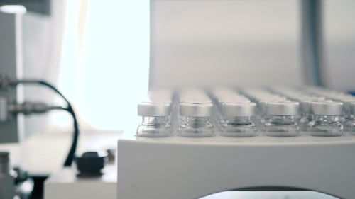 Rows of Medical Vials in a Bright Laboratory