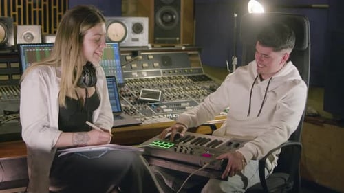 Two Talented Musicians Working at Music Recording Studio