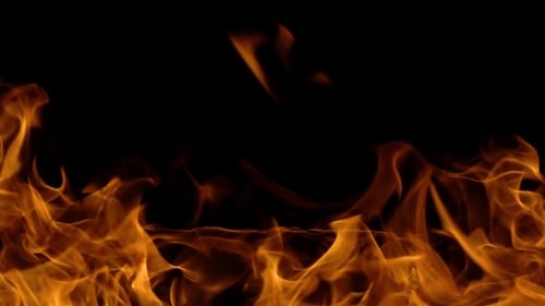 Golden Flames Flickering on Black Background