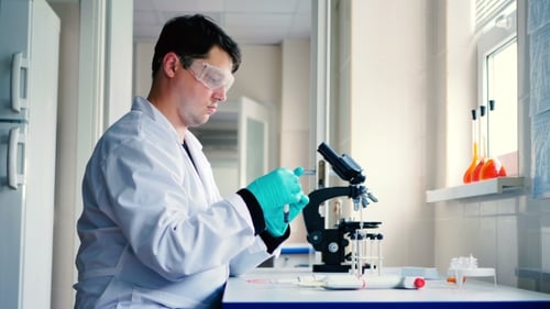 Scientist Working with Test Tubes in a Laboratory