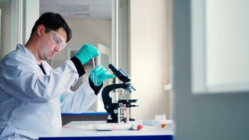 The Researcher Working with Blood in a Laboratory