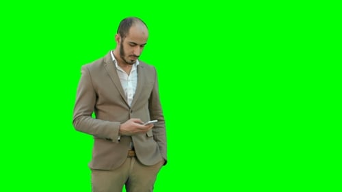 Busy Man in Suit Sending Text Messages on the Phone