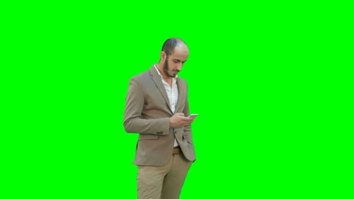 Man Using Mobile Phone on Green Screen