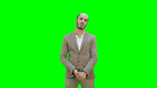 Businessman Presenting Project Looking at Camera on a Green Screen, Chroma Key