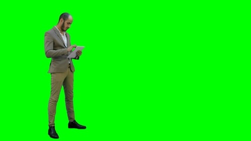 Man Using Tablet on Green Screen Background