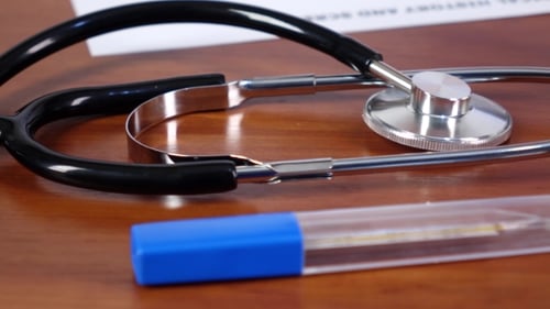 Doctor Puts Blue and Green Medical Pills, Cam Moves To the Right