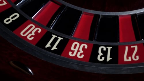 Usual Roulette Wheel Running with Fallen White Ball, Top View