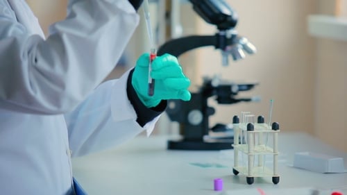 Technician Opens a Closed Tube of Blood.