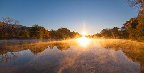 Golden Sunrise Over a Misty Lake