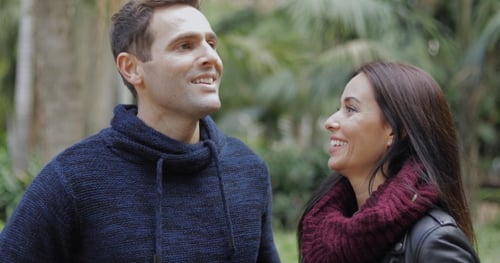 Couple Conversing Together in a Park Setting