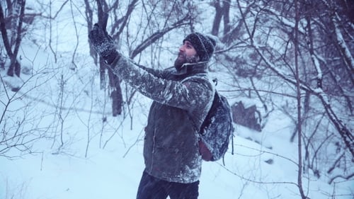 Man Takes Pictures in Beautiful Winter Forest