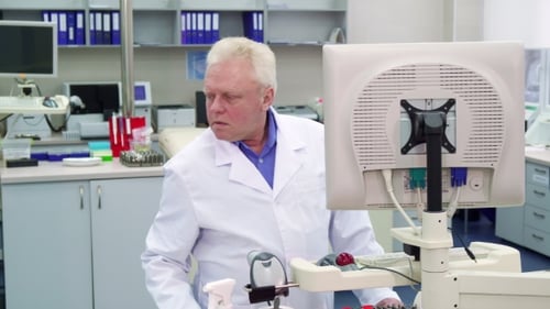Man Works in Bright Medical Research Lab