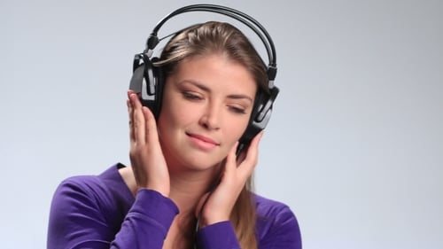 Woman Enjoying Music with Large Headphones