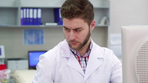 Male Scientist Works at the Laboratory