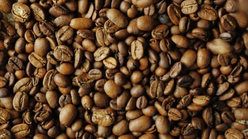 Roasted Coffee Beans Falling Close Up