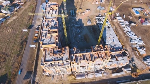 Construction Site with a Bird's Eye. Shooting with Drone. Building in the Field