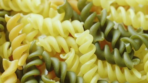 Uncooked Pasta in the Form of Spiral of Different Colors